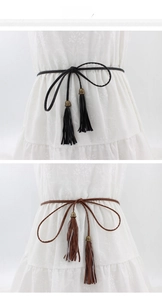 Detail view of woven PU waist belts in black and brown with vintage tassel ends
