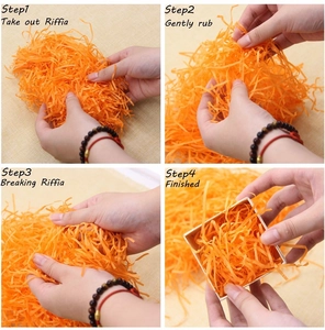 Four-step guide showing how to fluff and place orange shredded paper in a gift box