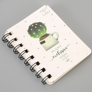 Detail of A7 spiral notebook featuring cactus watercolor illustration and black dual-wire binding