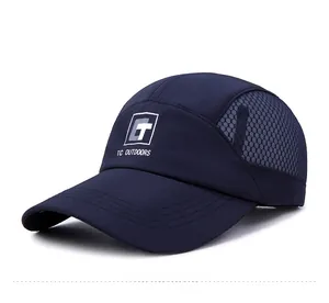 Detail view of the breathable mesh fabric and TC OUTDOORS logo on the navy blue cap
