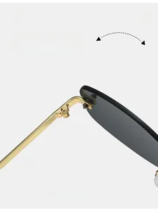 Detail of durable gold metal hinges and dark lenses on Y2K rimless sunglasses