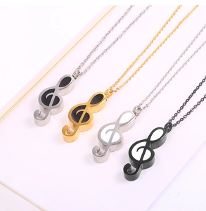 Detailed view of musical note pendant necklaces in four color variations with chains