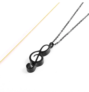 Detail of music note cremation necklace in black stainless steel with white inlay