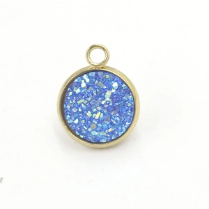 Detailed view of 12mm gold-plated round pendant with glittering blue resin stone
