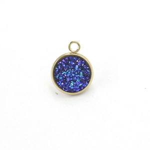 Detail of round golden stainless steel pendant with dark blue and purple druzy resin inlay