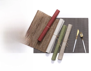 Detailed view of woven PVC placemats with bamboo texture and durable cross-weave craft