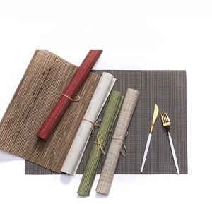 Macro detail of Teslin PVC woven placemats with bamboo texture in five assorted colors