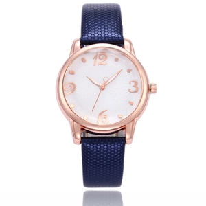 Elegant rose gold quartz watch with floral dial and dark blue snakeskin texture strap