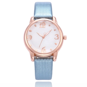 Elegant rose gold quartz watch with floral white dial and light blue textured leather strap