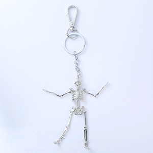 Detailed view of silver skull keychain with movable limbs and spring hook mechanism