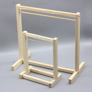 Detailed view of large and small wooden display stands with a minimalist design