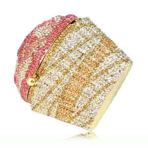 Detailed macro view of the cupcake-shaped evening clutch with pink and gold rhinestones