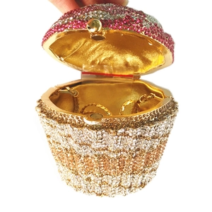 Detailed view of cupcake clutch interior with gold lining and sparkling rhinestones