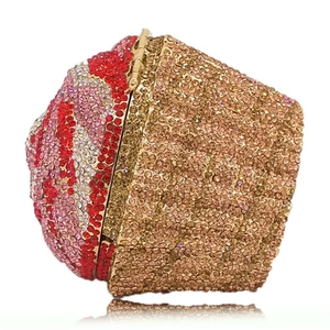 Macro shot of cupcake clutch purse with colorful crystals and golden hollow metal base