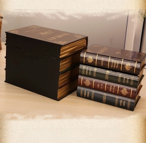 Macro detail of vintage literary book storage boxes with classic gold foil lettering