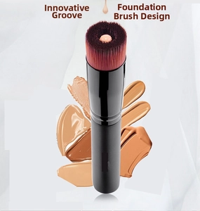 Detail of unique concave groove on round foundation brush head with synthetic bristles