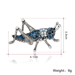 Retro insect grasshopper brooch with blue rhinestones and dimensions 4.1cm x 2.9cm