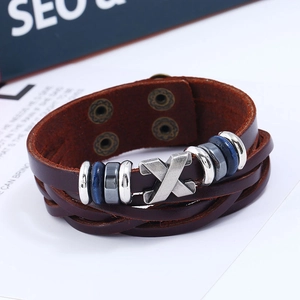 Men's brown layered braided leather bracelet with X-shaped metal bead and blue accents