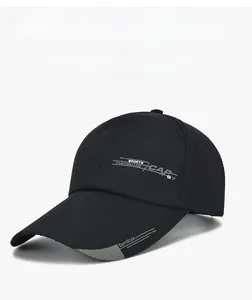 Detailed view of black sports baseball cap with grey letter printing and contrast brim