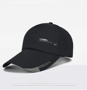 Detail view of black canvas baseball cap showing SPORTS FASHION print and curved brim