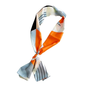 Elegant bow-tied silk scarf with geometric orange, blue and striped pattern on white backdrop