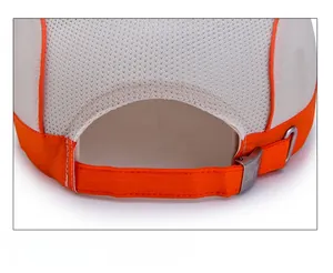 Detail of breathable mesh kids sport hat with adjustable orange strap and metal buckle