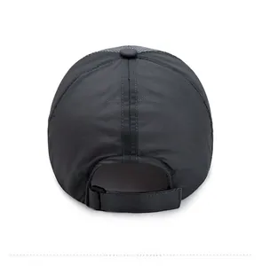 Rear view of black quick-dry sun hat with adjustable strap and breathable mesh panels