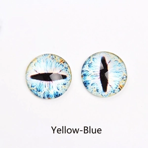 Macro detail of yellow and blue glass eye cabochons with realistic slit pupil iris