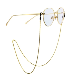 Golden metal sunglass chain with sleek thin-frame glasses shown in a 45-degree side view