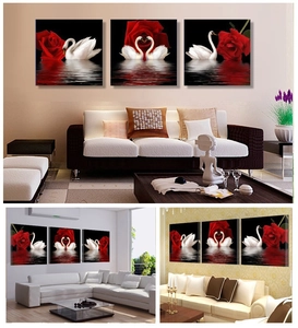Modern wall art showing heart-shaped swans and red roses over black water reflection