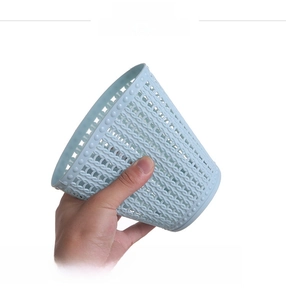 Detail of flexible light blue PP plastic mini storage bin with woven hollow pattern