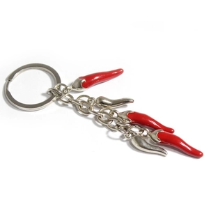 Detailed close-up of a vibrant red chili pepper alloy pendant on a silver keychain loop