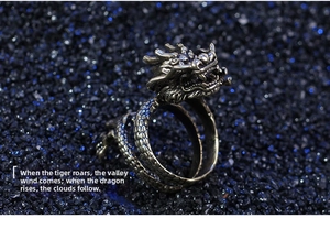 Macro detail of vintage dragon ring featuring intricate scales and antique gold finish