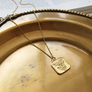 Vintage 925 silver square necklace featuring a golden rose relief on a brass plate
