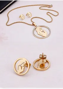 Detail of gold-plated stainless steel jewelry set with sparkling rhinestones and twisted chain