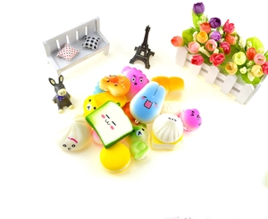 Macro shot of assorted colorful squishy slow-rebound PU foam donut and bread charms