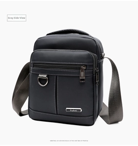 Detailed side view of grey waterproof oxford shoulder bag with multi-layer zippers and metal D-ring