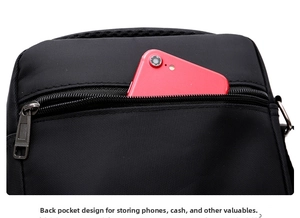 Detail of the rear anti-theft zipper pocket on Oxford cloth bag with a red smartphone