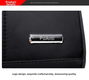 Macro shot of PuAnti brand metal logo on black waterproof oxford fabric shoulder bag