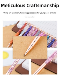 Detail of elegant gold leaf ballpoint pens with crystal filled barrels and rose gold clips