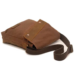 Vintage brown canvas crossbody shoulder bag with leather trim and adjustable strap
