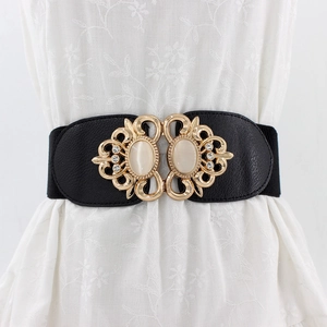 Women's black elastic waist belt with ornate gold buckle and double opal stone inlays