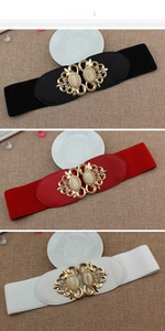 Detailed view of elastic waist belts featuring retro gold buckles with cat eye stones
