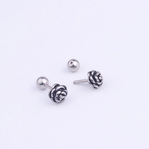 Vintage stainless steel rose ear studs with antique finish and ball back on white background