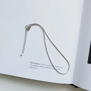 Close-up of S925 sterling silver stamp on thick snake chain ankle bracelet