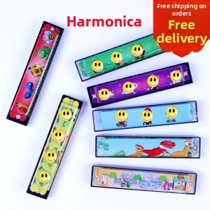 Detailed view of colorful children's harmonicas with cartoon patterns and smile faces