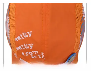 Detail of orange quick-dry hat with breathable mesh side and white lettering prints