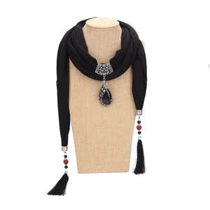 Ethnic style black scarf necklace with silver peacock pendant and red beaded tassels