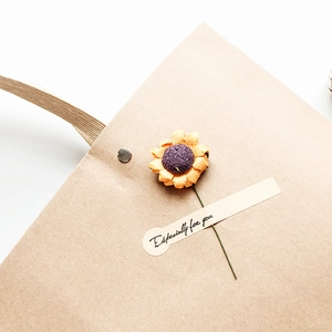 Brown kraft paper gift bag with sunflower decoration and 'Especially for you' tag