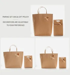 Macro detail of kraft paper gift bag set with dried sunflower and thank you tag